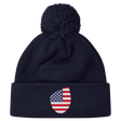 Just In: EMB Canterbury's USA Shield Pom Pom Beanie in navy blue, showcasing a cozy knit design with a playful pom-pom on top and featuring the USA Shield patch on the cuff.