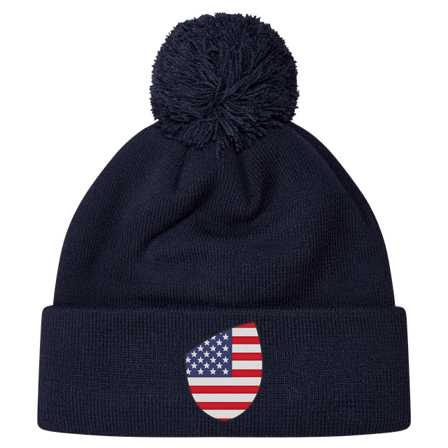 Just In: EMB Canterbury's USA Shield Pom Pom Beanie in navy blue, showcasing a cozy knit design with a playful pom-pom on top and featuring the USA Shield patch on the cuff.