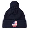 Just In: EMB Canterbury's USA Shield Pom Pom Beanie in navy blue, showcasing a cozy knit design with a playful pom-pom on top and featuring the USA Shield patch on the cuff.