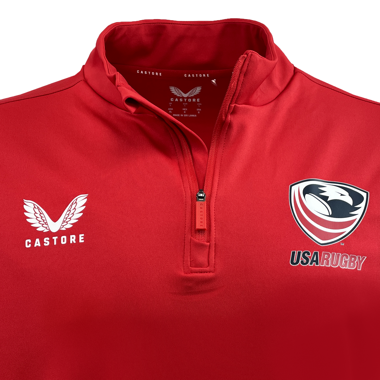 The USA Rugby 1/4 Zip by Castore, in vibrant red, is an ideal choice for Eagles fans. It proudly displays a clean white Castore logo on the left side and the iconic USA Rugby emblem on the right, combining style and pride seamlessly.