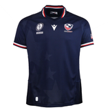 Cheer for Team USA at the Women’s Rugby World Cup 2025 in the Macron USA Rugby WRWC25 Replica Home Jersey, featuring a navy design with red, white, and blue accents, chest logos, and an American flag patch on the sleeve.