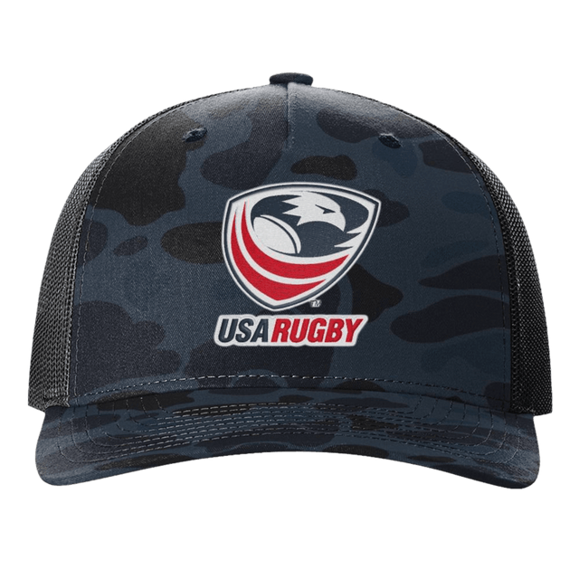 The EMB S&S Activewear USA Rugby Printed Five-Panel Trucker Cap comes in black and dark blue camo, featuring the iconic eagle and red rugby ball logo, plus an adjustable snapback for a comfortable fit.