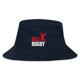 The EMB S&S Activewear USA Rugby Throwback Crusher Bucket Hat is made from durable cotton twill and features the red USA Rugby logo with an eagle above "RUGBY" in white on the front, combining style and sun protection.