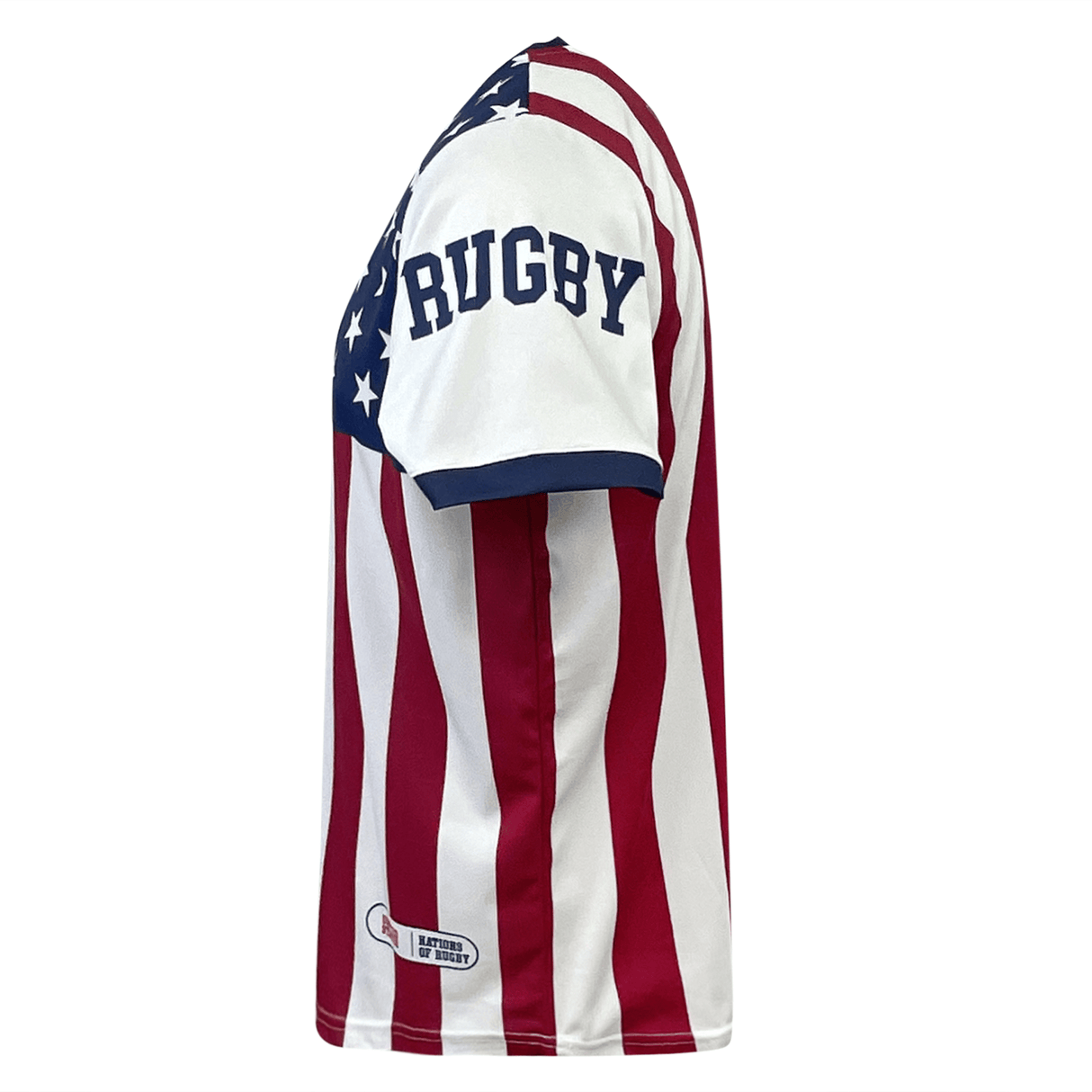 Side view of an athletic shirt with red and white vertical stripes, blue accents, and the word "RUGBY" on the sleeve. A portion of a star pattern is visible on the upper torso, reminiscent of a Nations of Rugby United States Sevens Rugby Flag Jersey by Admiral.