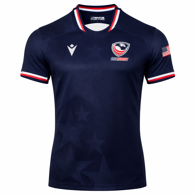 Show your support with the USA Rugby 24/25 Authentic Matchday Home Jersey by Macron—navy blue with white, red, and blue trim, USA Rugby logo, Macron branding, and an American flag patch. Ideal for fans and players alike.