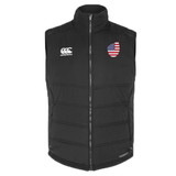 The USA Shield Core Gilet by EMB Canterbury is a black padded vest with a high collar, featuring the Canterbury logo on the right chest and an American flag on the left. This stylish and patriotic piece ensures you stand out with its unique details.