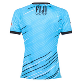 The Fiji 7's 25/26 Replica Away Jersey by Umbro features a blue design with black and white diagonal stripes, short sleeves, and "FIJI WATER" on the upper back—replicating the iconic Fiji sevens look.