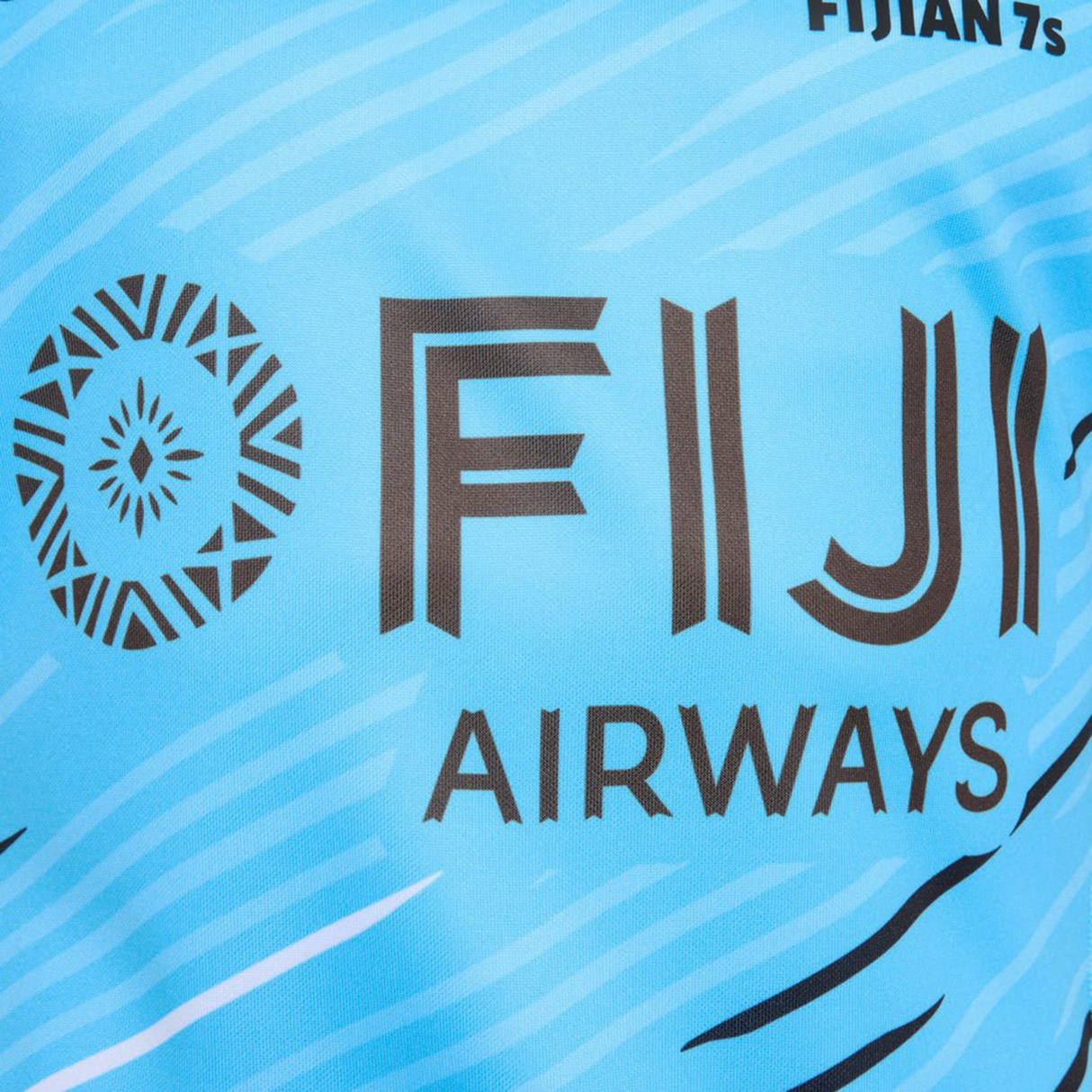 Close-up of the Fiji 7's 25/26 Replica Away Jersey by Umbro, showing "FIJI AIRWAYS" and a circular logo on the front.