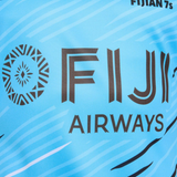 Close-up of the Fiji 7's 25/26 Replica Away Jersey by Umbro, showing "FIJI AIRWAYS" and a circular logo on the front.