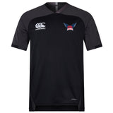 The University of Southern Indiana Women Vapodri Evader Jersey by EMB Canterbury is a black and dark gray short-sleeve jersey with moisture-wicking Vapodri tech, featuring the Canterbury logo on the right chest and a USA Rugby logo on the left.