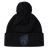 The Uruguay Shield Pom Pom Beanie by EMB Canterbury showcases a stylish black design with a striking blue bird logo on the front, combining fashion and warmth perfectly.