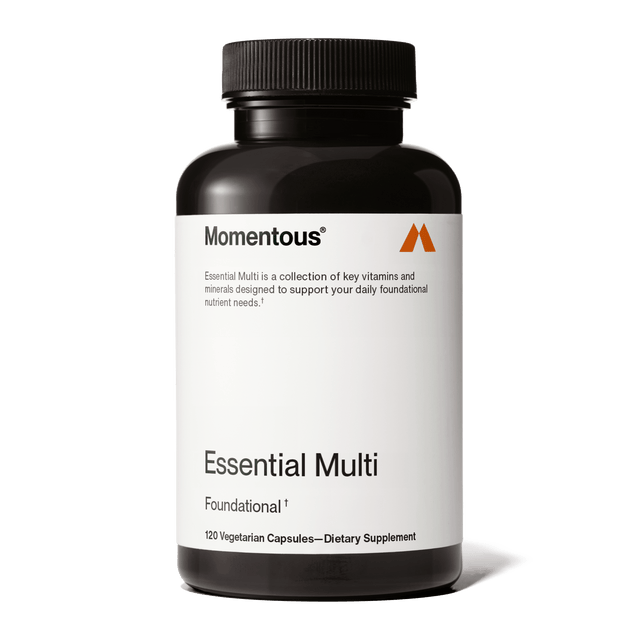 A black bottle labeled "Momentous Multivitamin" by Momentous contains 120 vegetarian capsules, offering daily foundational nutrient support and immune benefits as a dietary supplement.