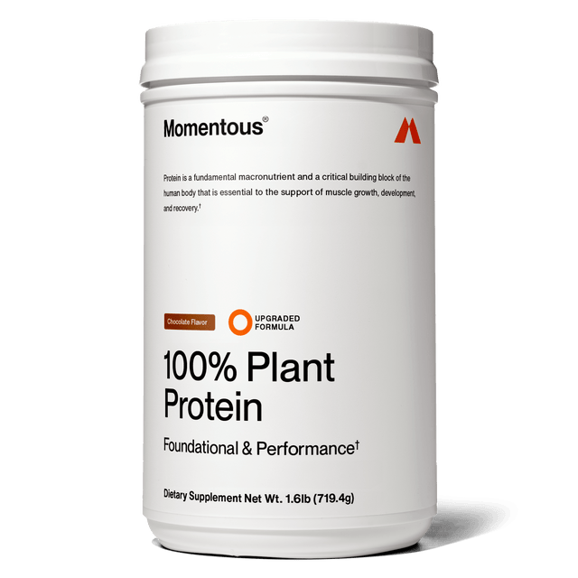 A white container of Momentous 100% Plant Protein Powder (chocolate) with black and orange label text. This NSF Certified for Sport supplement by Momentous provides a complete amino acid profile for optimal nutrition.
