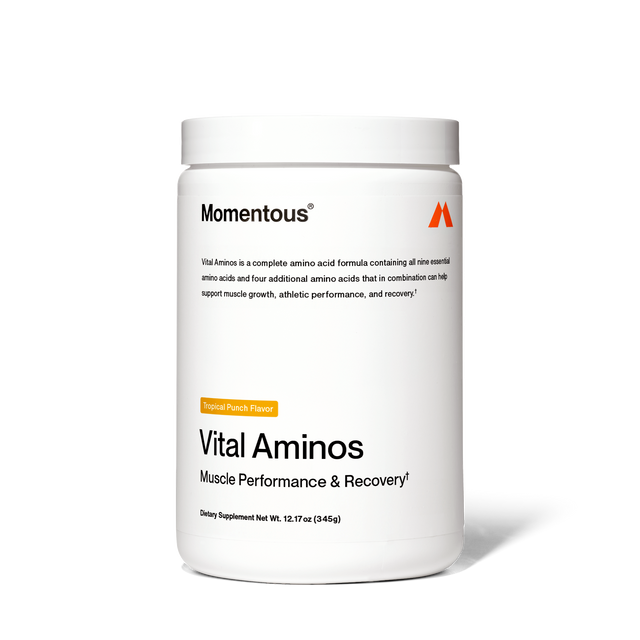 A white container of Momentous Vital Aminos by Momentous, Tropical Punch Flavor, labeled for muscle performance and recovery, contains 12.7 oz (345g) of essential amino acids dietary supplement.
