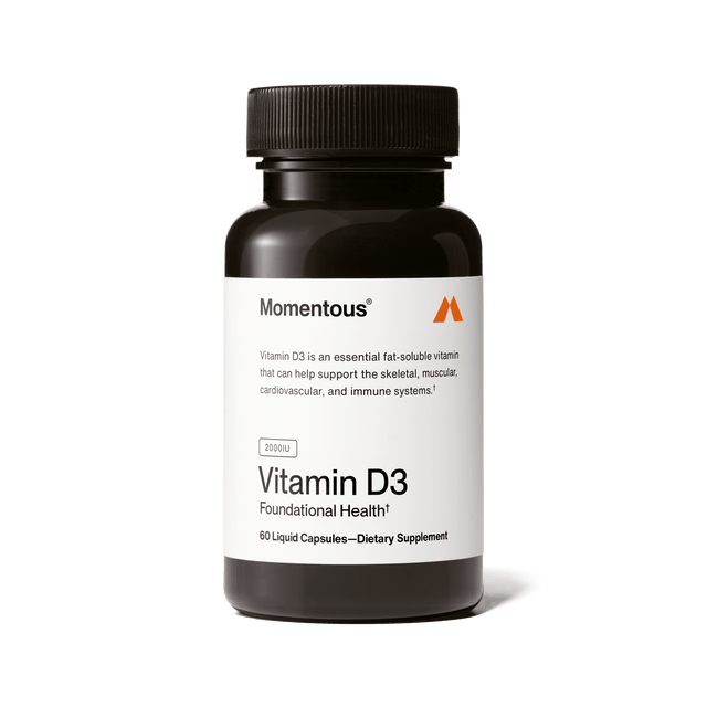 A black bottle labeled "Momentous Vitamin D3 2000 IU" from Momentous, with 60 liquid capsules, is a dietary supplement that supports bone health plus skeletal, muscular, cardiovascular, and immune systems.