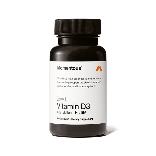 Momentous Vitamin D3 5000 IU by Momentous comes in a black bottle with 60 capsules, providing 5000 IU per serving to help support bone strength and immune health as a foundational supplement.