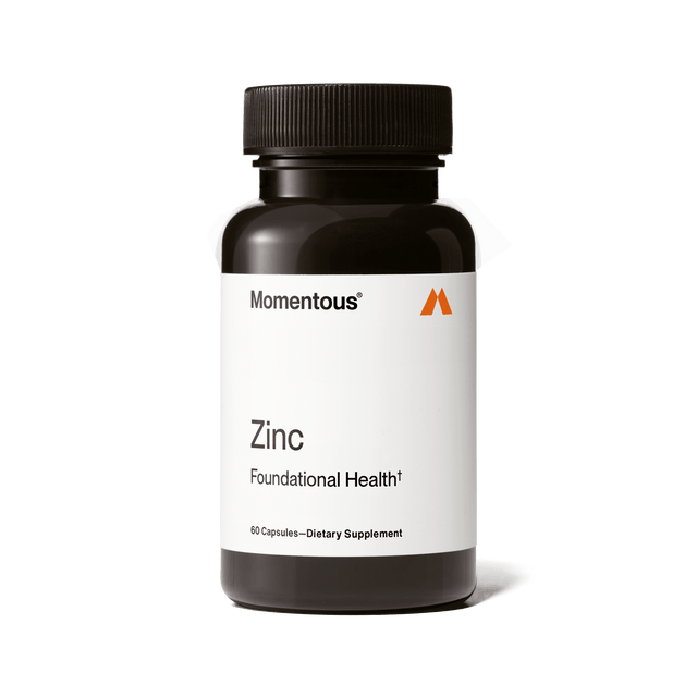 A black bottle labeled "Momentous Zinc" by Momentous, containing 60 zinc supplement capsules for immune support and metabolic health, is displayed against a white background.