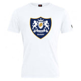 The Villanova Rugby Club Plain Tee by WRS Canterbury is a white cotton-blend t-shirt featuring a classic blue and gold crest with two lions, a crown, and "RUGBY" beneath the shield—perfect for fans seeking customization.