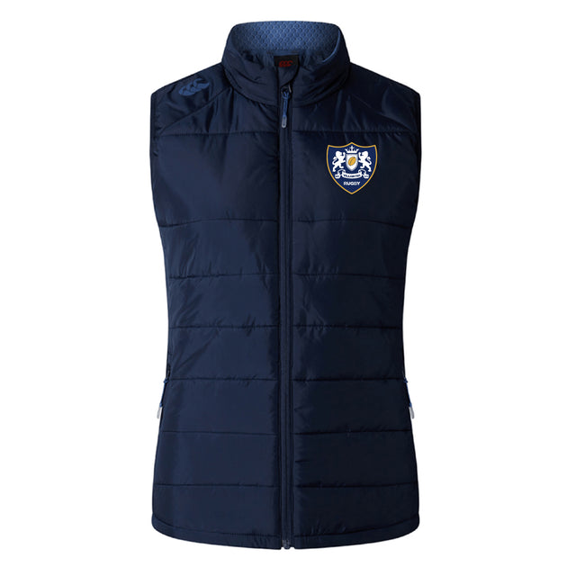 The Villanova Rugby Club Women's Elite Microlite Gilet by Canterbury features a front zipper, Thermoreg bonded fleece for warmth, and a crest patch with rugby emblem on the left chest. Brand: EMB Canterbury.