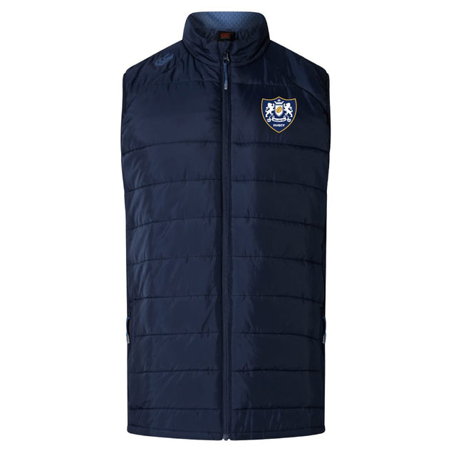The EMB Canterbury Villanova Rugby Club Elite Microlite Gilet is a navy quilted insulated vest with a front zipper and a two-lion shield crest logo on the left chest.