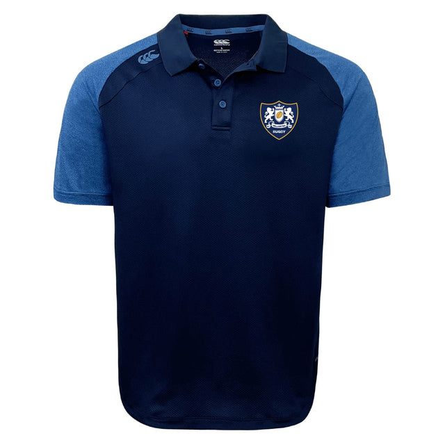 The Villanova Rugby Club Elite Polo by EMB Canterbury features navy and light blue colors, short sleeves, a collar, button placket, embroidered chest crest, logo on the shoulder, and lightweight Vapodri fabric for all-day comfort.
