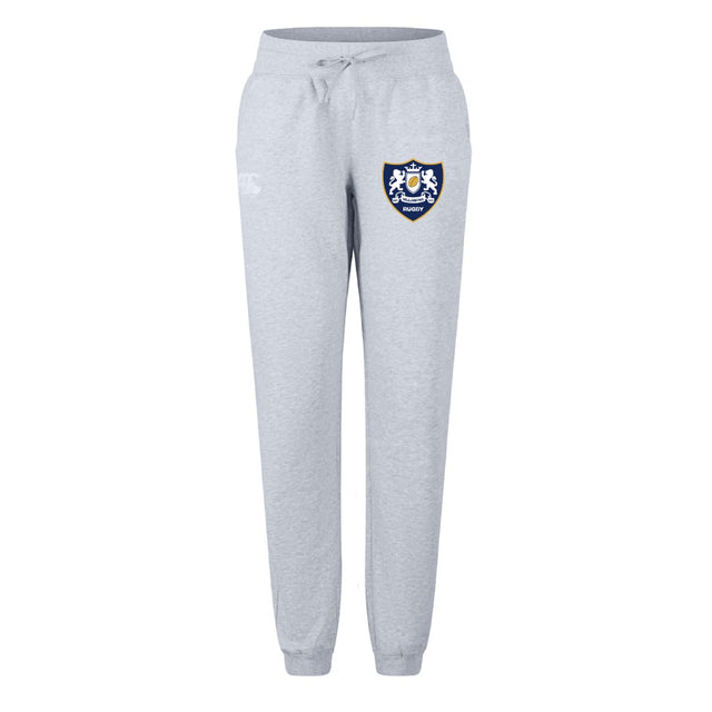 The Villanova Rugby Club Women's Leisure Sweatpant by EMB Canterbury features light grey organic cotton, a drawstring waist, ribbed cuffs, and a blue and white embroidered crest—ideal for relaxing or rugby training sessions.