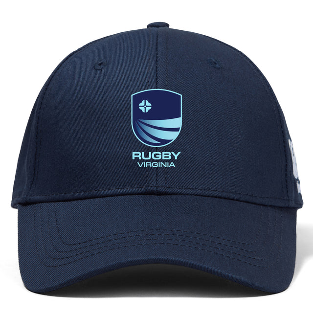 The Rugby VA Flexfit Drill Cap by EMB Canterbury is a navy blue cap with a blue and white shield logo and "RUGBY VIRGINIA" embroidered on the front.
