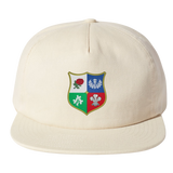 The Nations of Rugby British & Irish Lions Vintage Brushed Cotton Cap by EMB Weld in beige features a vibrant shield emblem with symbols like a rose.