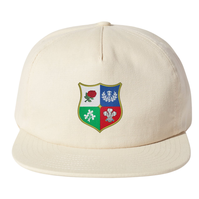 The Nations of Rugby British & Irish Lions Vintage Brushed Cotton Cap by EMB Weld in beige features a vibrant shield emblem with symbols like a rose.