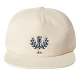 The Nations of Rugby Scotland Vintage Brushed Cotton Cap by EMB Weld features a blue thistle emblem and the number "1871" on the front, with an adjustable snapback closure, perfect for rugby fans.