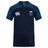 The Washington Renegades VapoDri Evader Jersey by EMB Canterbury is navy blue with a white logo on the left and a crest on the right, designed with VapoDri Technology for enhanced comfort—a must-have for any Rugby World Cup fan.