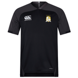 The Waukesha Gold Rugby Vapodri Evader Jersey by EMB Canterbury features a stylish black design with short sleeves, adorned with the iconic Canterbury logo on the right chest and a shield emblem on the left. Its VapoDri finish provides superior moisture-wicking technology for enhanced performance and comfort.