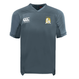 The Waukesha Gold Rugby Vapodri Evader Jersey by EMB Canterbury is a gray sports jersey featuring the distinctive Canterbury logo on the right chest and an embroidered emblem on the left. It has short sleeves and a V-neck design, enhanced with VapoDri moisture-wicking technology to ensure optimal comfort.