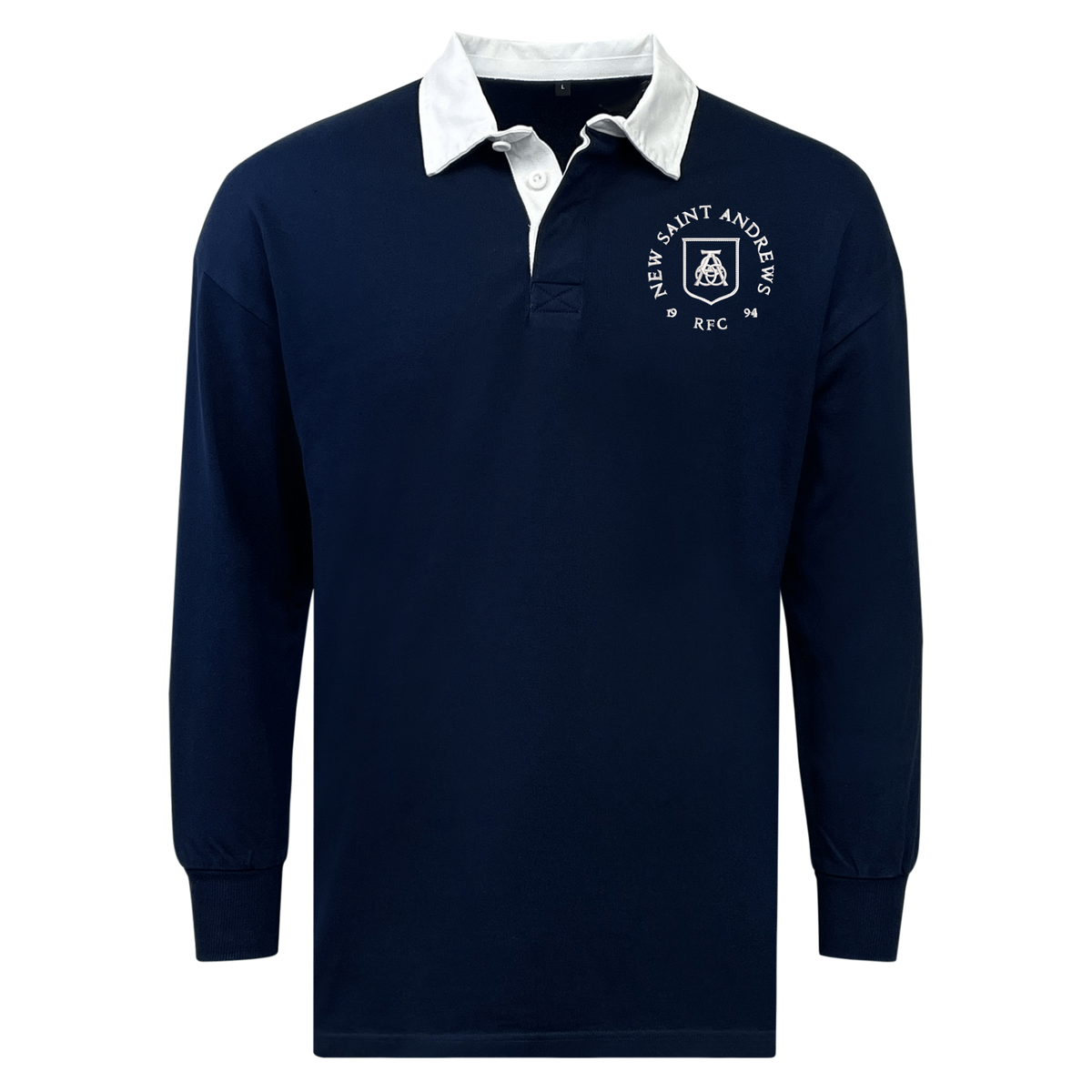 The EMB Mudoo New Saint Andrews College Classic Long Sleeve Solid Rugby Jersey features a navy blue design with a white collar and a crest on the left chest that reads “New Saint Andrews RFC ’94.” This timeless rugby shirt offers a relaxed fit for comfortable, all-day wear and enduring style.