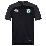 The Woodlands Youth Vapodri Evader Jersey by EMB Canterbury is a black short-sleeve rugby jersey with a round neck, Canterbury logo on the right chest, wolf paw emblem on the left, and moisture-wicking tech for comfort.