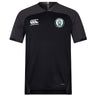 The Woodlands Youth Vapodri Evader Jersey by EMB Canterbury is a black short-sleeve rugby jersey with a round neck, Canterbury logo on the right chest, wolf paw emblem on the left, and moisture-wicking tech for comfort.