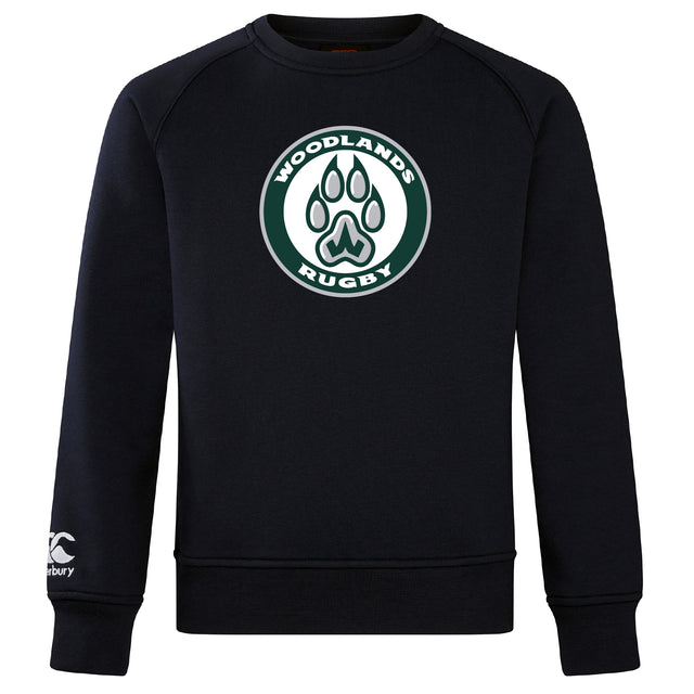 The Woodlands Youth Club Crew Sweatshirt by WRS Canterbury features an ultra-soft feel, a circular "Woodlands Rugby" logo with paw print on the chest, and an embroidered CCC logo on the left sleeve.
