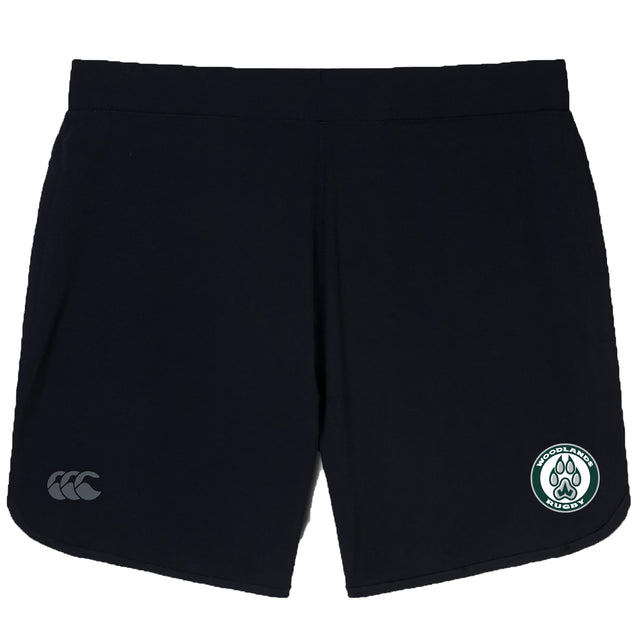 The Woodlands Youth Elite Woven Short by EMB Canterbury features a white "CCC" logo on the left leg, zippered pockets, and a green and white "Middlebury Rugby" paw print emblem on the right leg.