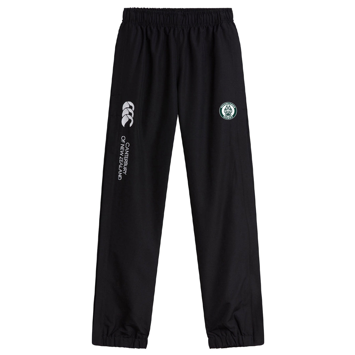 Woodlands Youth Cuffed Hem Stadium Pant by EMB Canterbury features an elastic waistband, cuffed hem, white Canterbury branding, and a circular green and white logo on the left thigh.