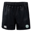 The Woodlands Youth Professional Polyester Rugby Short by EMB Canterbury features black fabric, an elastic waistband, a white Canterbury logo on the left hem, and a green and white Woodland Rugby Club badge on the right hem.