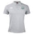 The Woodlands Youth Waimak Polo by EMB Canterbury is a light gray short-sleeve polo with a button collar, featuring the Canterbury logo on the right chest and a circular green, white, and black emblem on the left.