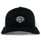 The EMB S&S Activewear Woodlands Youth Wolfpack Retro Trucker Cap features a black and white design with mesh back, an embroidered three-wolf "Woodlands Rugby" logo on the front, and an adjustable snapback closure.