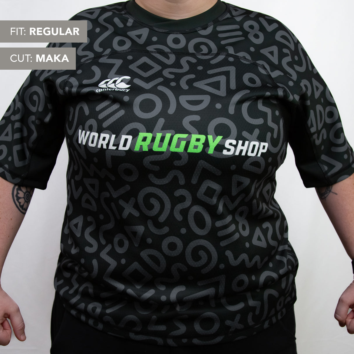 A person wearing a black Teamatical Canterbury Elite Full Custom Sublimated Jersey – Women's with gray abstract patterns; text on image notes "Fit: Regular" and "Cut: Maka.