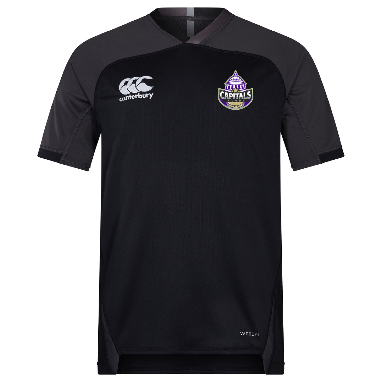 The Capitals Rugby NC Vapodri Evader Jersey by EMB Canterbury is a black short-sleeve jersey with moisture-wicking tech, Canterbury logo on the right chest, and a purple "Capitals" logo on the left.