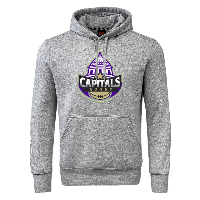 The Capitals Rugby NC Club Hoodie by WRS Canterbury is a gray rugby hoodie with a bold "Capitals Rugby" logo, featuring a purple dome and gold rugby ball on the front.