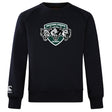 The Woodlands Youth Wolfpack Club Crew Sweatshirt by WRS Canterbury features a black ultra-soft design, embroidered "Woodlands Rugby" with three wolf heads on the chest, and a small Canterbury logo on the sleeve.