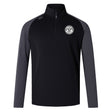 The EMB Canterbury White River Rugby Football Club Elite First Layer is a black and dark gray VapoDri quarter-zip pullover with a white circular crest on the chest—perfect as a rugby training top.