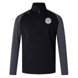 The EMB Canterbury White River Rugby Football Club Elite First Layer is a black and dark gray VapoDri quarter-zip pullover with a white circular crest on the chest—perfect as a rugby training top.