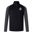 The EMB Canterbury Capitals Rugby NC Elite First Layer is a black training top with dark gray sleeves, a quarter-zip, VapoDri technology, and a Sacramento Capitals chest emblem.