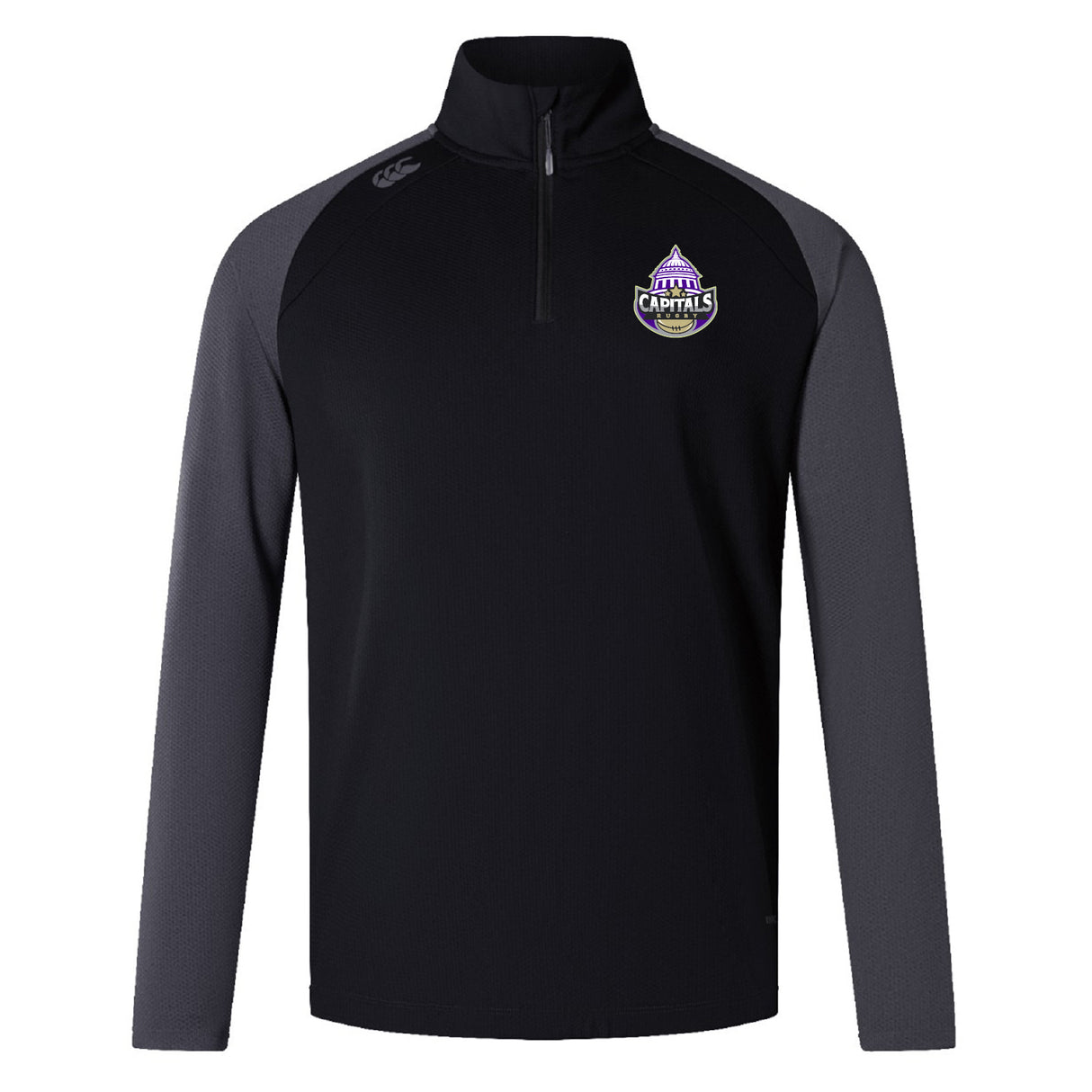 The EMB Canterbury Capitals Rugby NC Elite First Layer is a black training top with dark gray sleeves, a quarter-zip, VapoDri technology, and a Sacramento Capitals chest emblem.